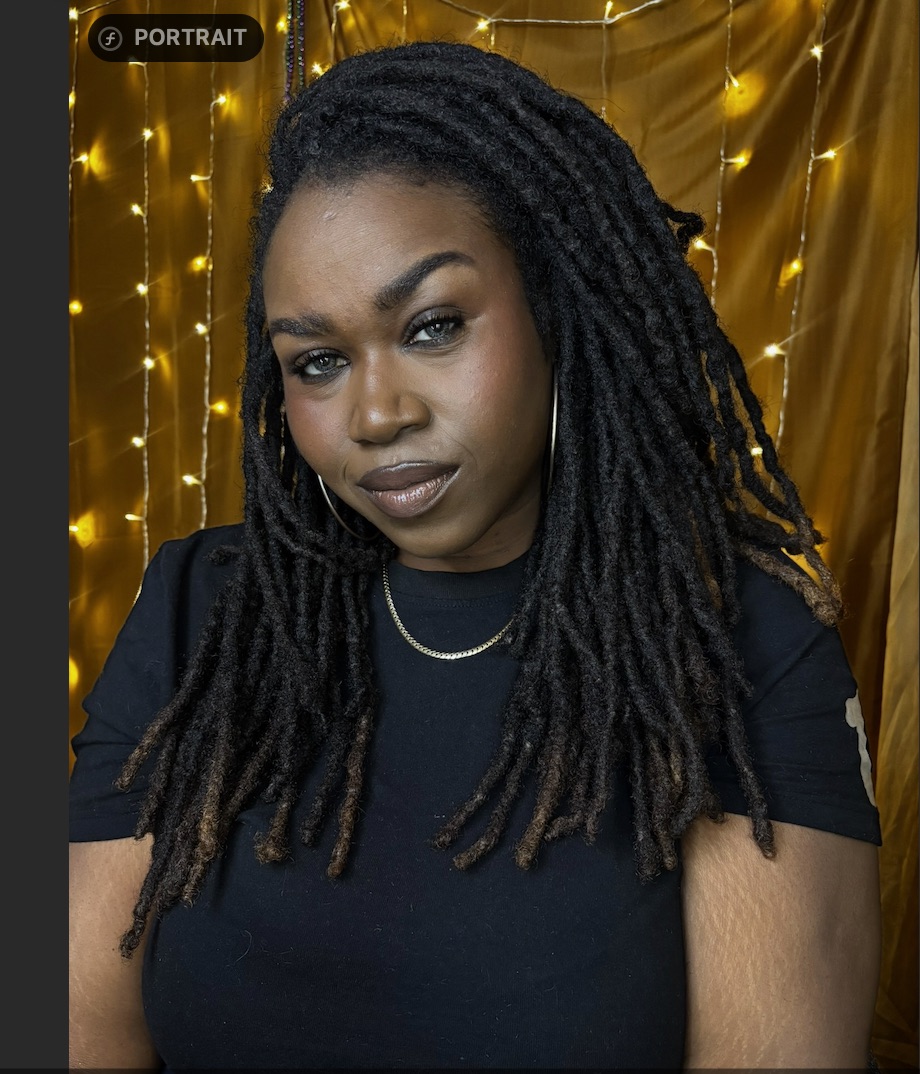 Crystal, creator of Clearly Loc’d, wearing black with her long locs
