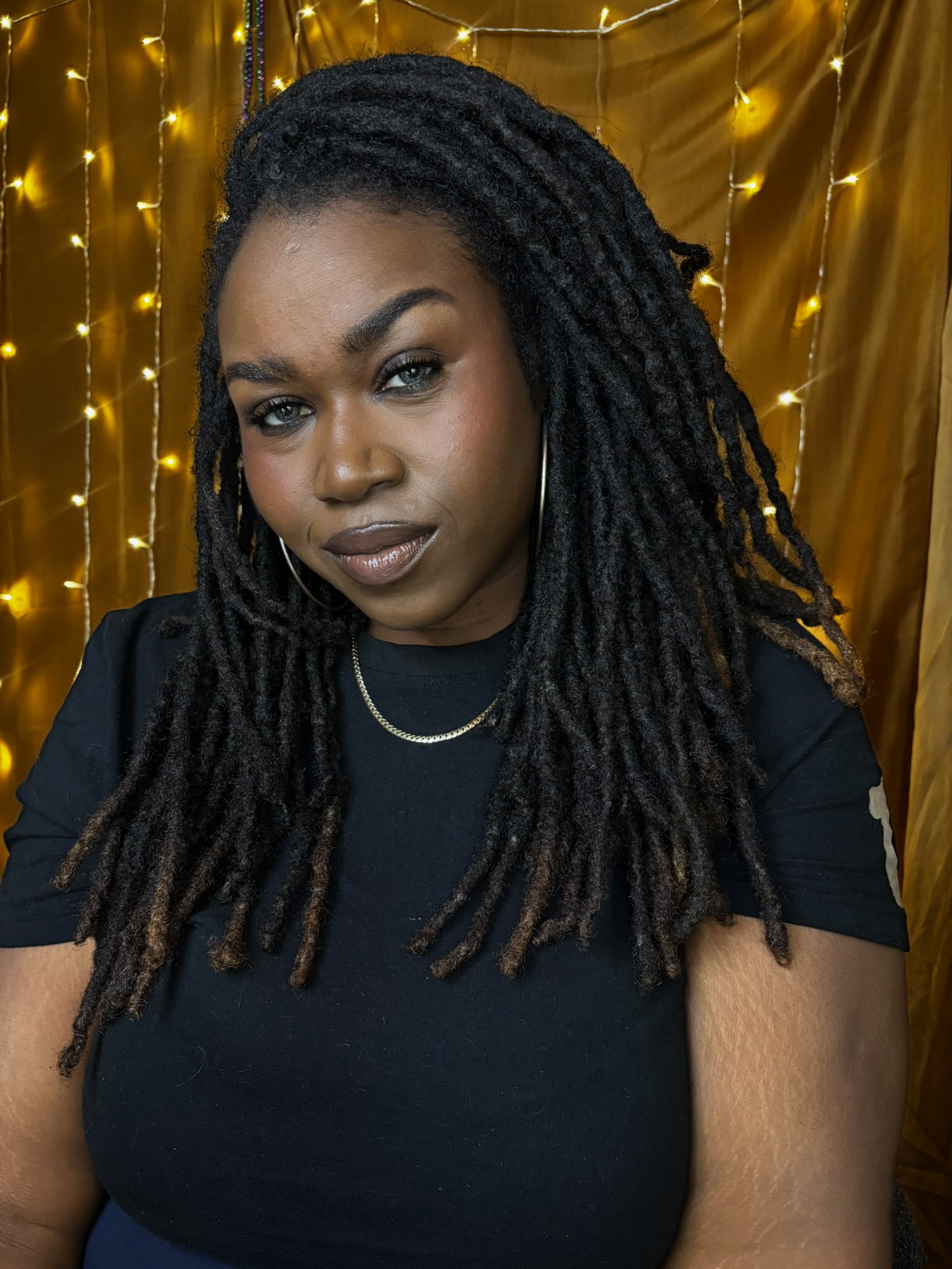 Crystal of Clearly Cryss wearing her long locs